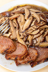 Image showing venison deer game filet and wild mushrooms