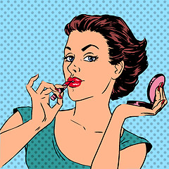 Image showing Girl paints lips with lipstick cosmetics beauty perfumes pop art