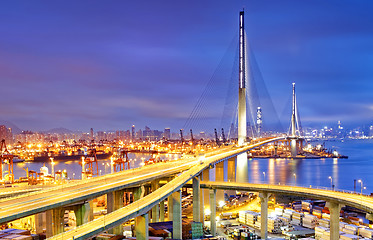 Image showing Container Cargo freight ship with working crane bridge in shipya