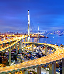 Image showing Container Cargo freight ship with working crane bridge in shipya