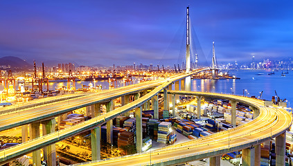 Image showing Container Cargo freight ship with working crane bridge in shipya