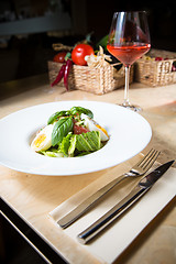 Image showing plate of spring mix salad with strawberry, eggs and tuna