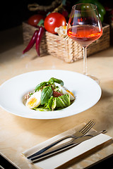 Image showing plate of spring mix salad with strawberry, eggs and tuna