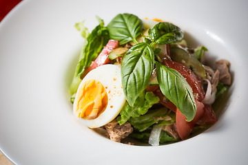 Image showing plate of spring mix salad with strawberry, eggs and tuna