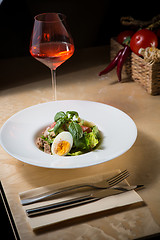 Image showing plate of spring mix salad with strawberry, eggs and tuna