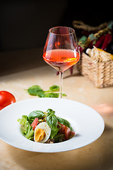 Image showing plate of spring mix salad with strawberry, eggs and tuna