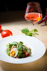 Image showing plate of spring mix salad with strawberry, eggs and tuna