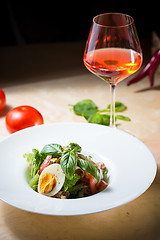 Image showing plate of spring mix salad with strawberry, eggs and tuna