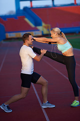 Image showing sporty woman on athletic race track