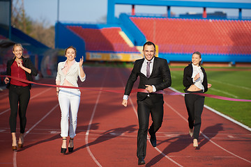 Image showing business people running on racing track