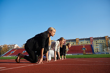 Image showing business people running on racing track