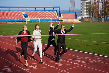 Image showing business people running on racing track