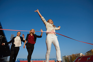 Image showing business people running on racing track