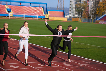 Image showing business people running on racing track