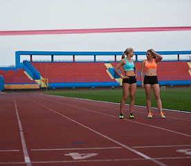 Image showing Female Runners Finishing Race Together