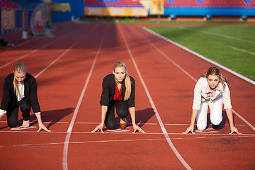 Image showing business people running on racing track