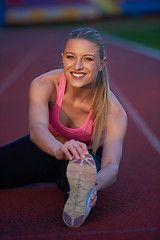 Image showing sporty woman on athletic race track