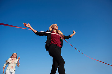 Image showing business people running on racing track