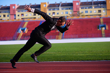 Image showing business man ready to sprint