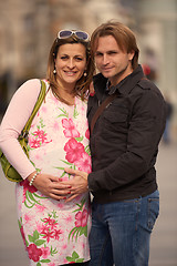 Image showing young pregnant couple have fun and relax