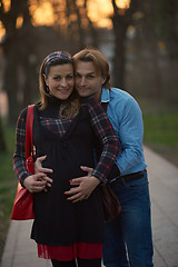 Image showing young pregnant couple have fun and relax