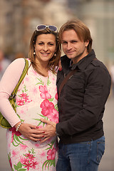 Image showing young pregnant couple have fun and relax