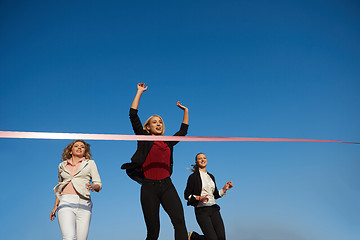 Image showing business people running on racing track