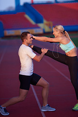 Image showing sporty woman on athletic race track