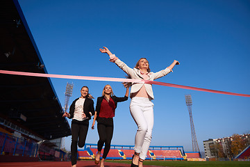 Image showing business people running on racing track