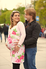 Image showing young pregnant couple have fun and relax