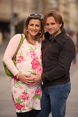 Image showing young pregnant couple have fun and relax