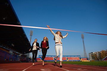 Image showing business people running on racing track