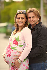 Image showing young pregnant couple have fun and relax