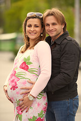 Image showing young pregnant couple have fun and relax