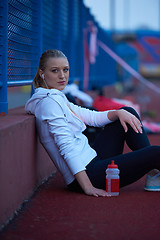 Image showing sporty woman on athletic race track