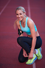 Image showing sporty woman on athletic race track