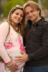 Image showing young pregnant couple have fun and relax