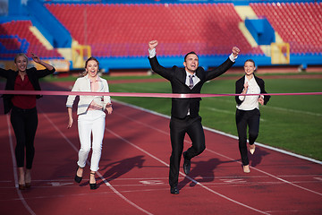 Image showing business people running on racing track