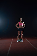 Image showing woman  sprinter leaving starting blocks