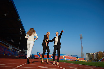 Image showing business people running on racing track