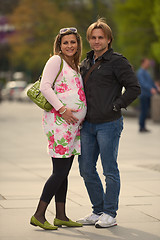 Image showing young pregnant couple have fun and relax