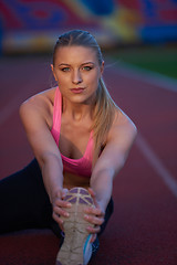 Image showing sporty woman on athletic race track