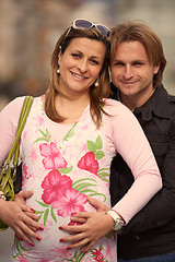 Image showing young pregnant couple have fun and relax