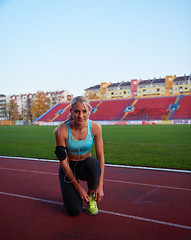 Image showing sporty woman on athletic race track