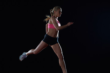 Image showing Athletic woman running on track