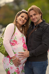 Image showing young pregnant couple have fun and relax