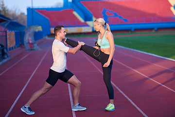 Image showing sporty woman on athletic race track