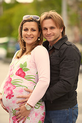 Image showing young pregnant couple have fun and relax