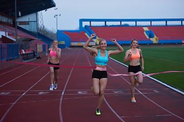 Image showing Female Runners Finishing Race Together