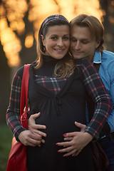 Image showing young pregnant couple have fun and relax